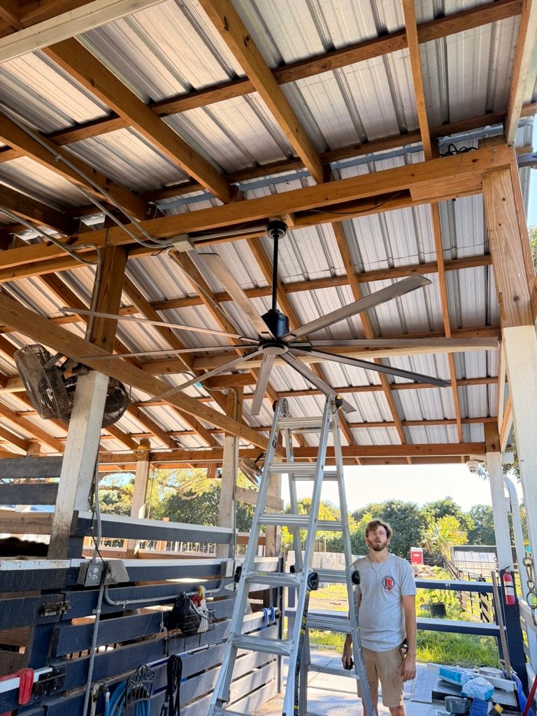 Crew member at a ranch ceiling-fan installation
