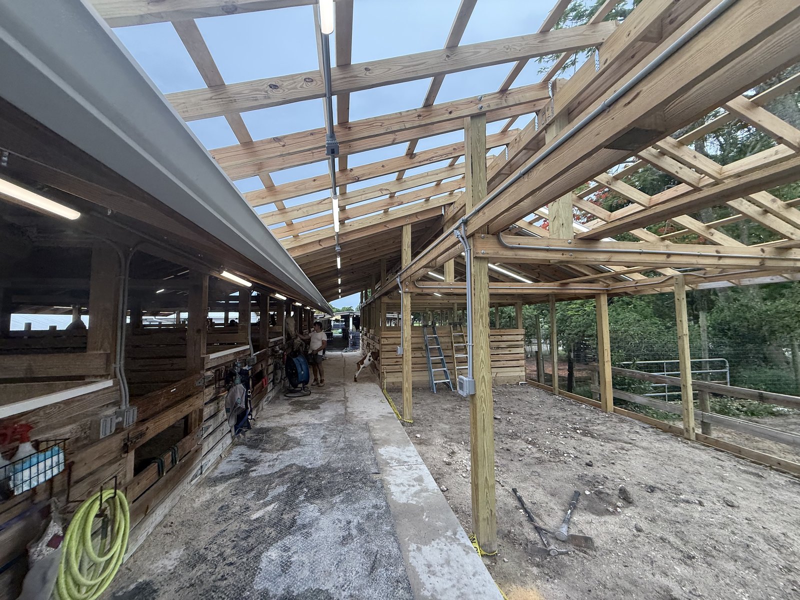 Conduit and lighting installation at a ranch